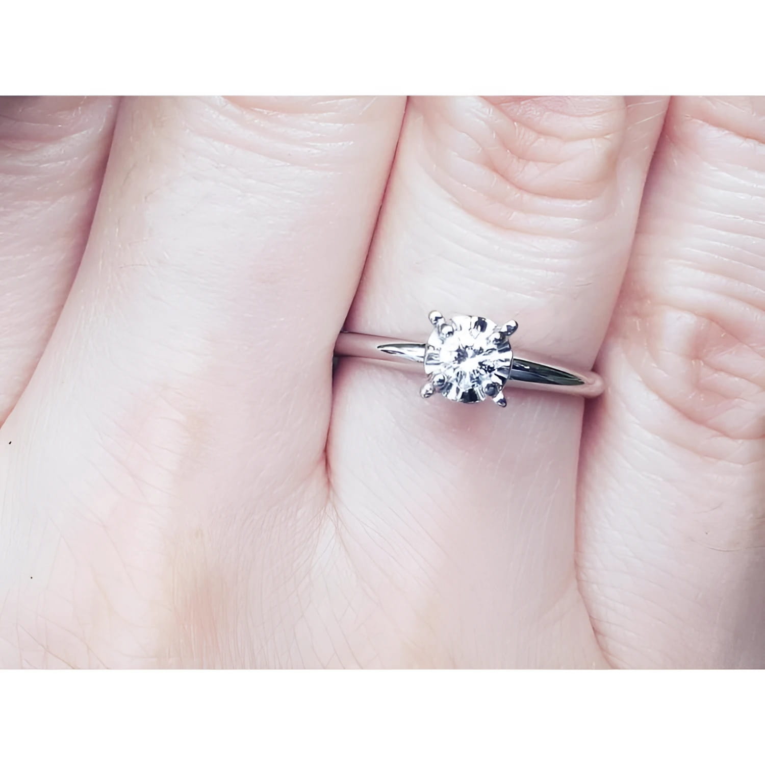 Natural diamond solitaire engagement ring 14k white gold.