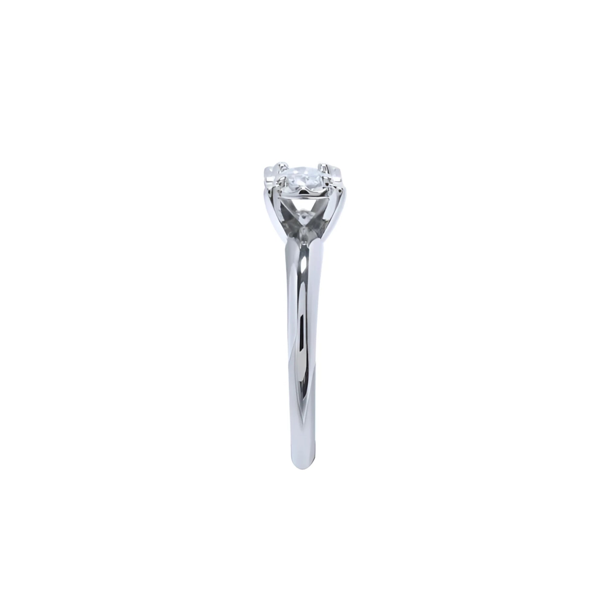 Round cut diamond solitaire engagement ring in 14K white gold with an illusion setting.