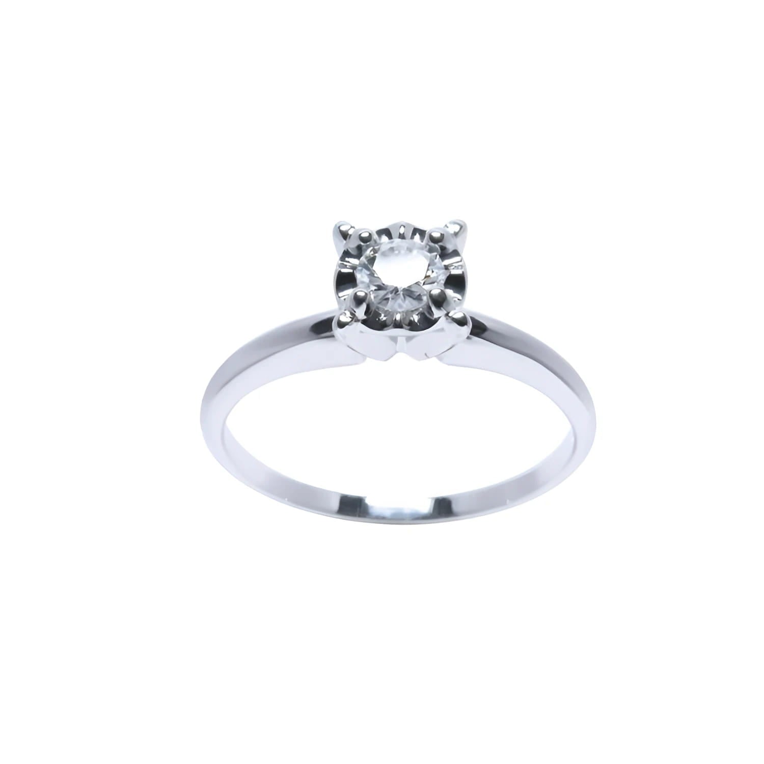Round cut diamond solitaire engagement ring in 14K white gold with illusion setting.