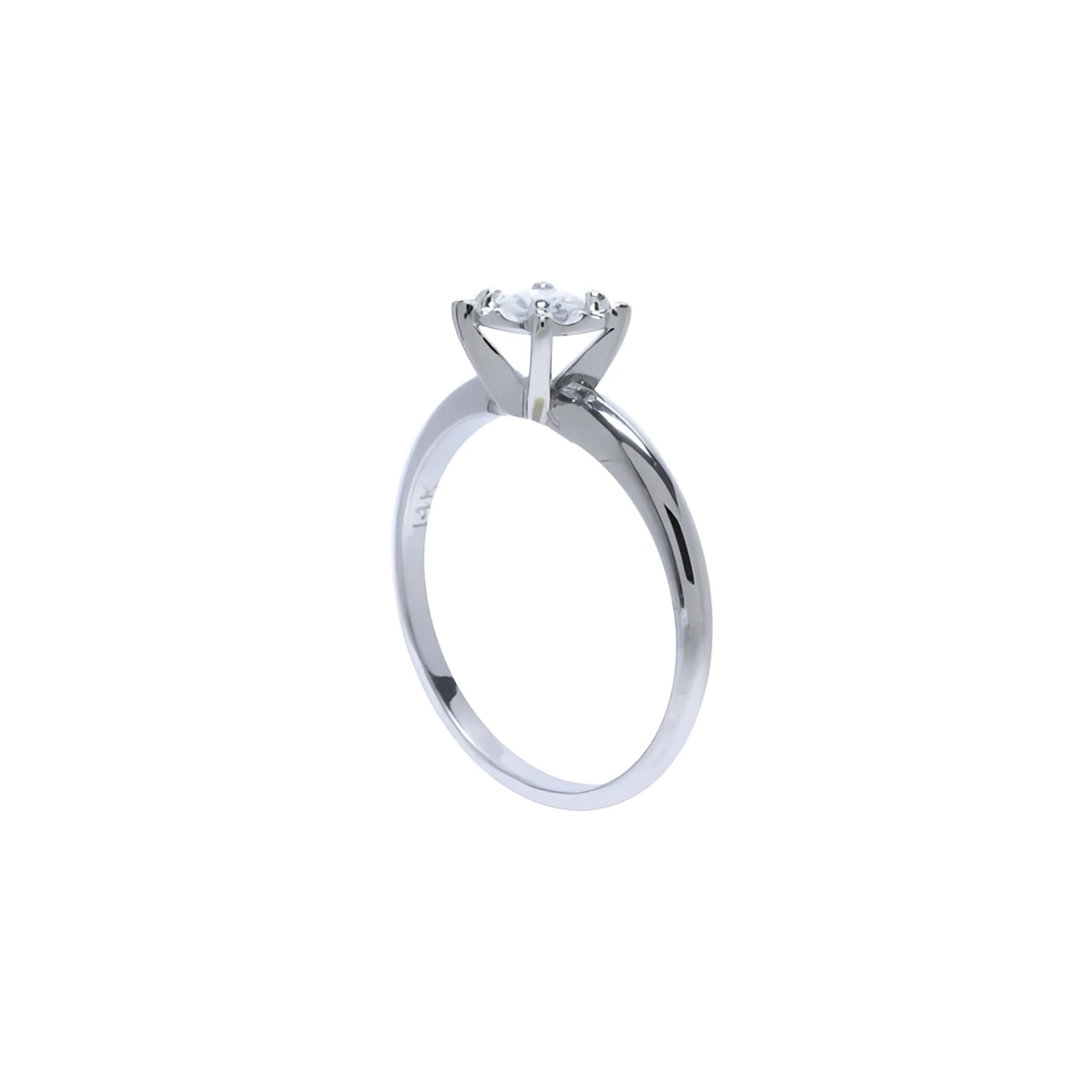 Round cut diamond solitaire engagement ring in 14K white gold with an illusion setting.