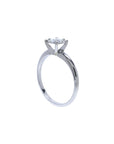 Round cut diamond solitaire engagement ring in 14K white gold with an illusion setting.