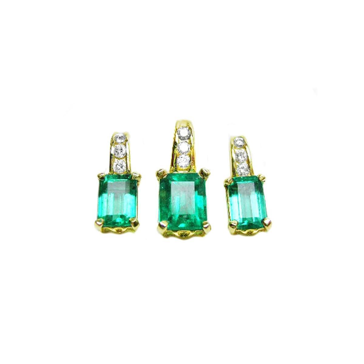 Front position of a trio set of emerald earrings and pendant, accent diamonds in 14k yellow gold, full top side view