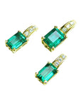 A trio matching set of emerald earrings and pendant in 14k yellow gold, left side position and top view