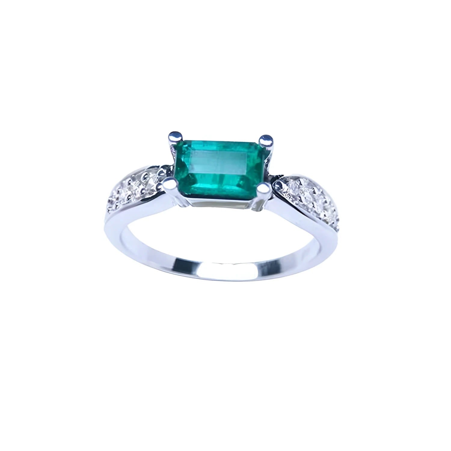 0.90 ct. East West emerald ring in 14k white gold with pave diamond accents.