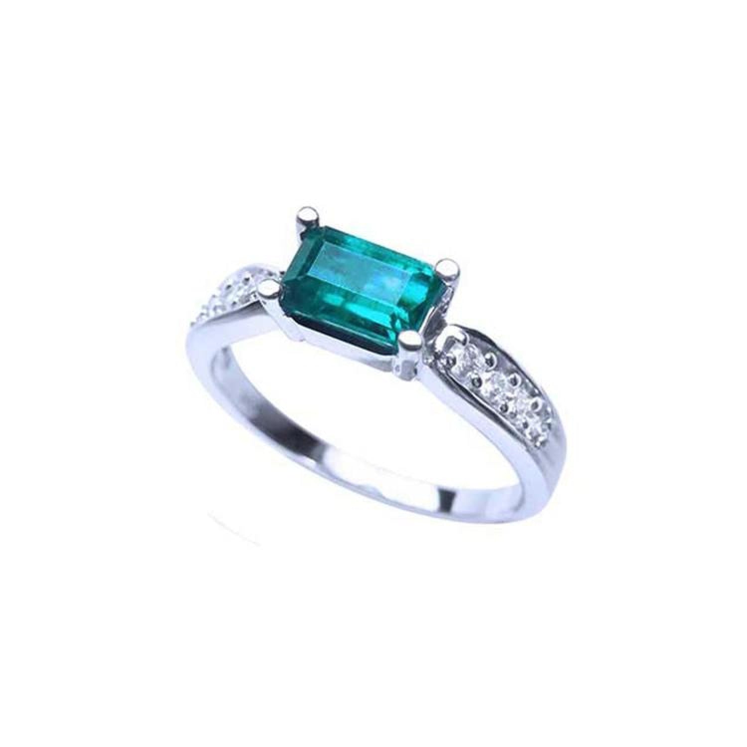 East West emerald ring with a vivid green rectangular emerald and diamond accents on a 14k white gold band.