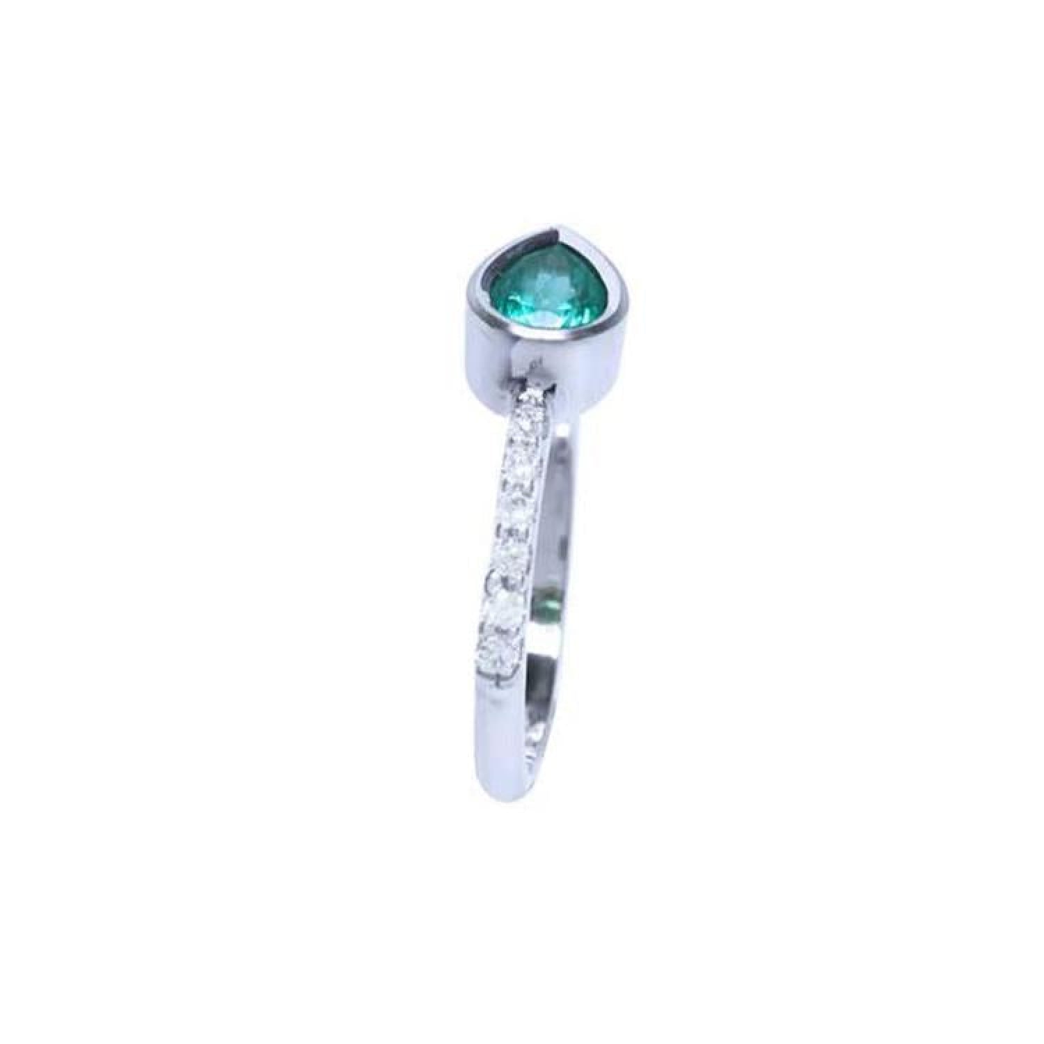 14K white gold ring with a bezel-set east-west teardrop emerald and diamond accents.
