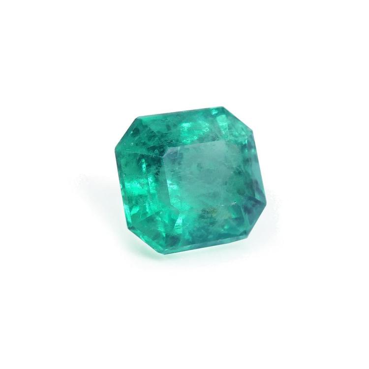 Natural square emerald from the Muzo mines Colombia, boasts a bright medium green hue and crystalline clarity.