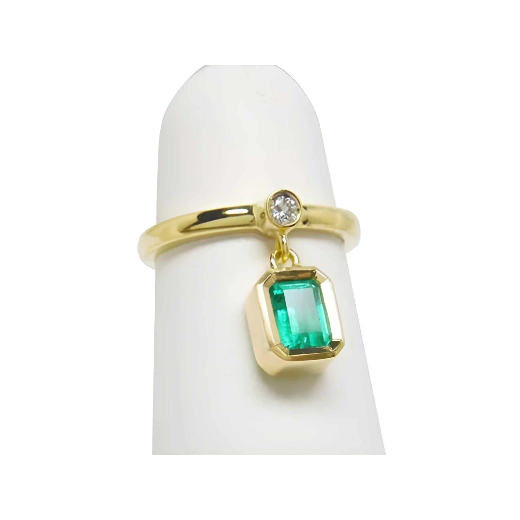 14K yellow gold dangle ring with a bezel-set emerald and small diamond accent.