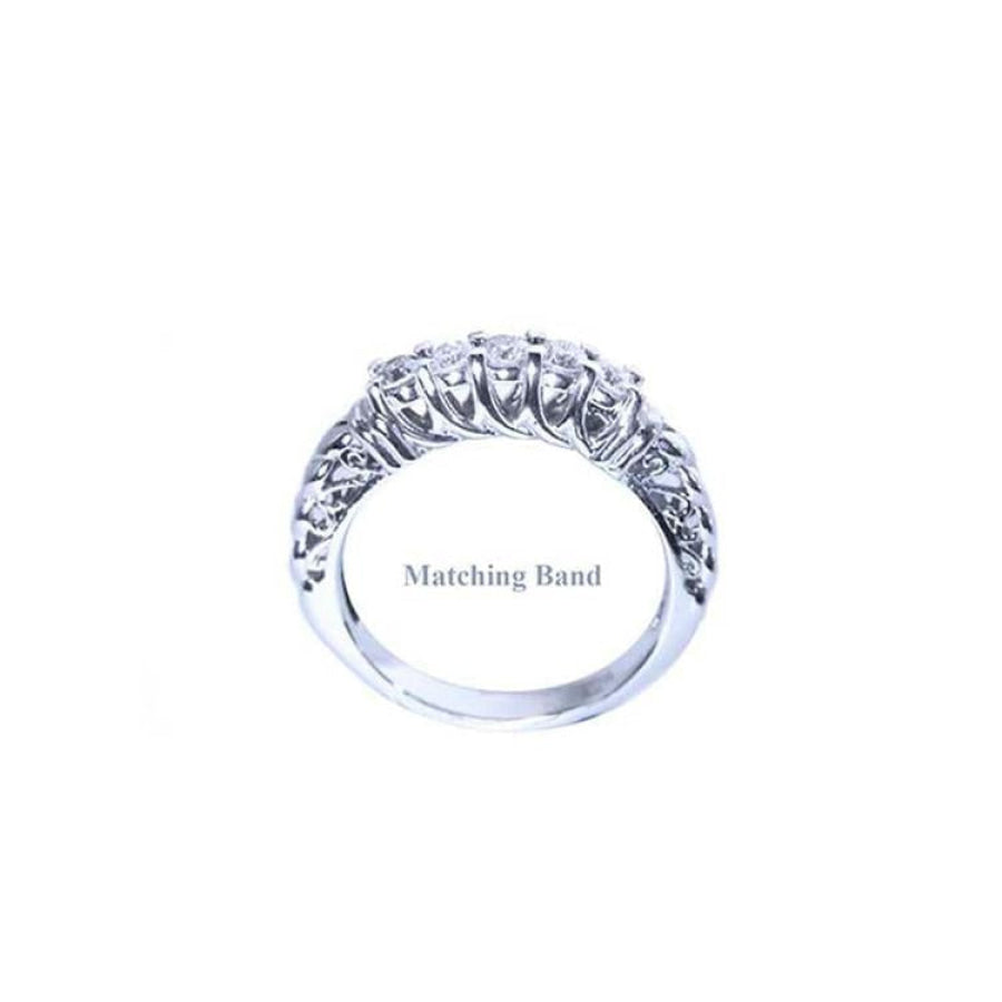 14K white gold diamond wedding band with intricate side detailing.