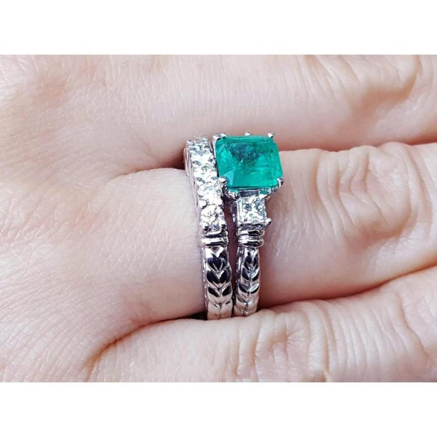 1.48 ct. emerald engagement ring and matching diamond wedding band set in 14K white gold.