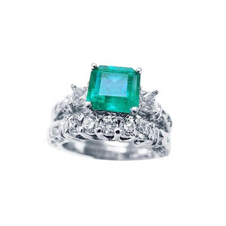 A Muzo Colombian emerald ring with a diamond matching band set in white gold.