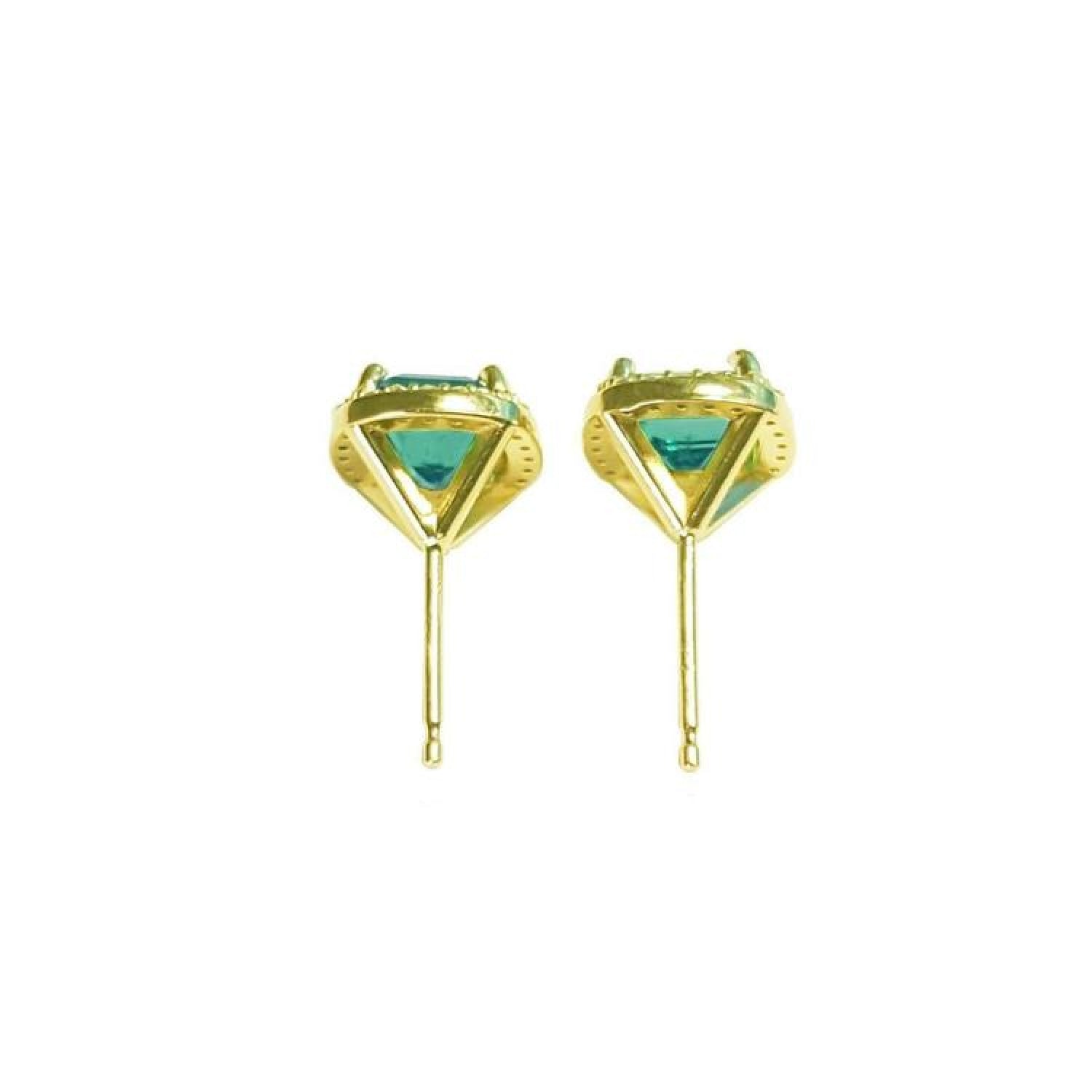 Pair of 14K yellow gold halo emerald stud earrings with vibrant green gemstones.