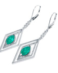 Diamond-shaped white gold Marquise emerald earrings, left side profile view
