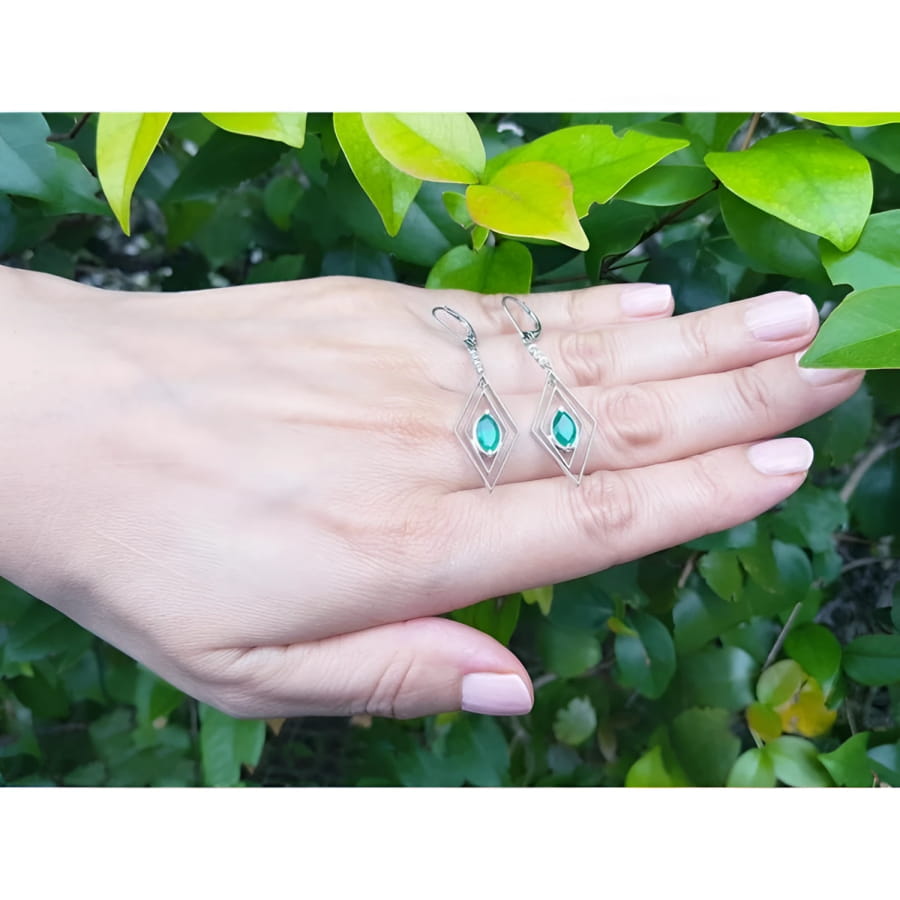 Emerald marquise earrings in 14K gold with deep bluish-green gems and diamond accents, dangling from lever backs.