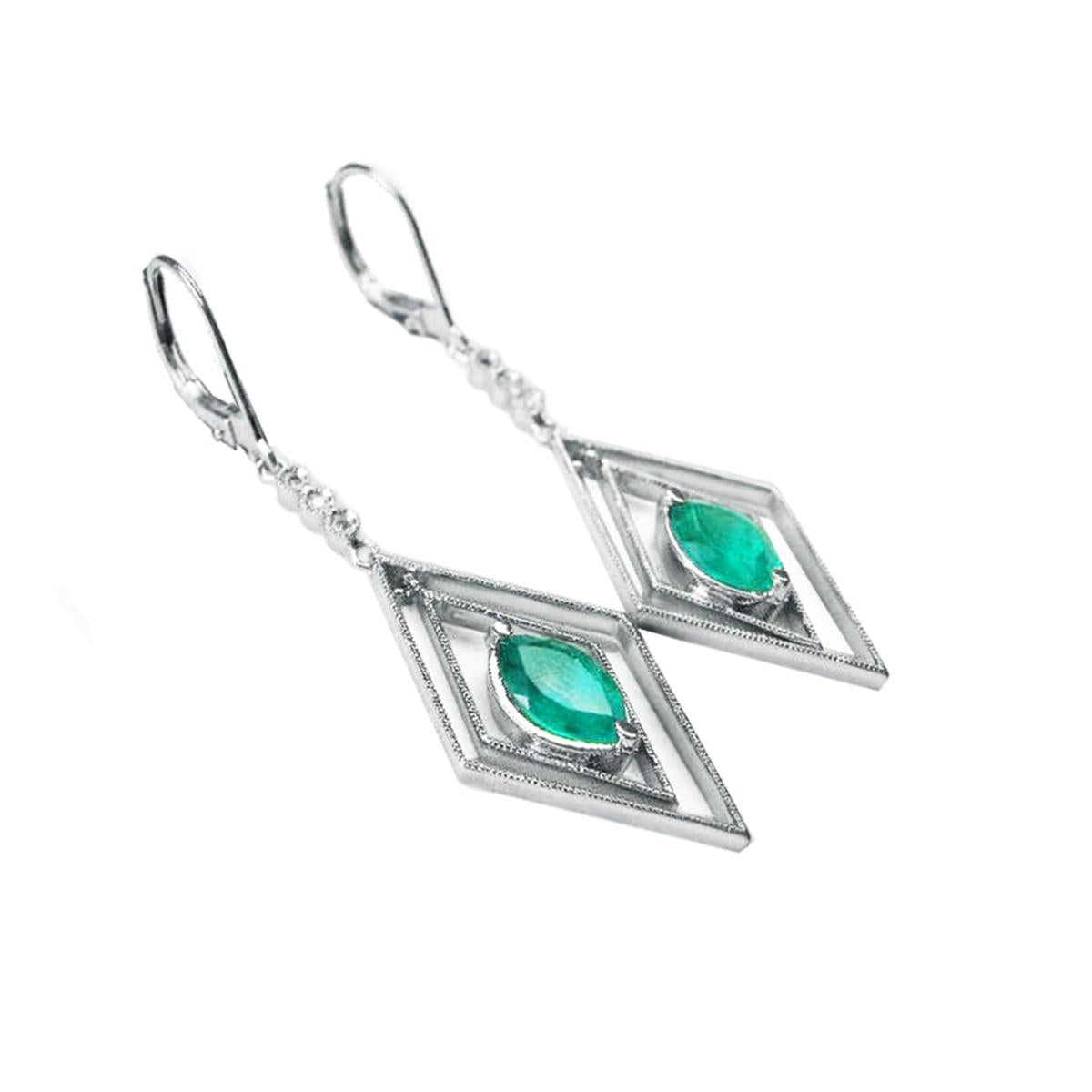 Pair of white gold emerald marquise earrings with lever backs on a left-side position and top view