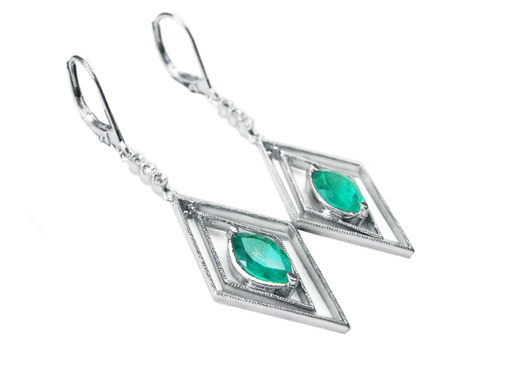 Pair of white gold emerald marquise earrings with lever backs on a left-side position and top view