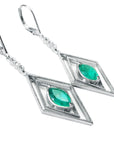 Pair of white gold emerald marquise earrings with lever backs on a left-side position and top view