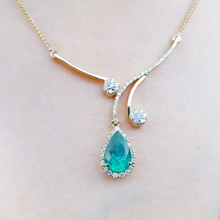 Women's necklace emerald and diamonds, sourced from the Muzo mines in Colombia a natural pear cut set in 18k yellow gold