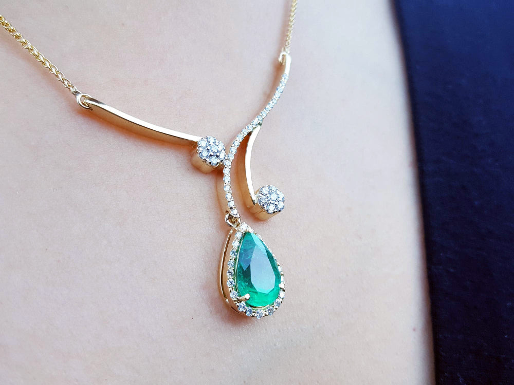 Gift for Mother&#39;s Day emerald necklace sourced from the Muzo mines, encircled by a halo diamond set in 18k yellow gold