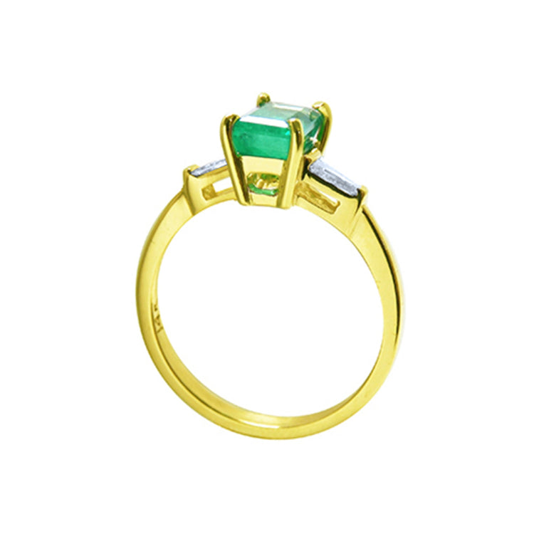 Affordable three stone emerald engagement ring yellow gold