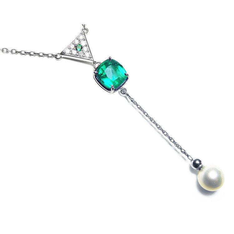 Cushion cut natural emerald necklace with freshwater pearl danglin, crafted in 14k white gold