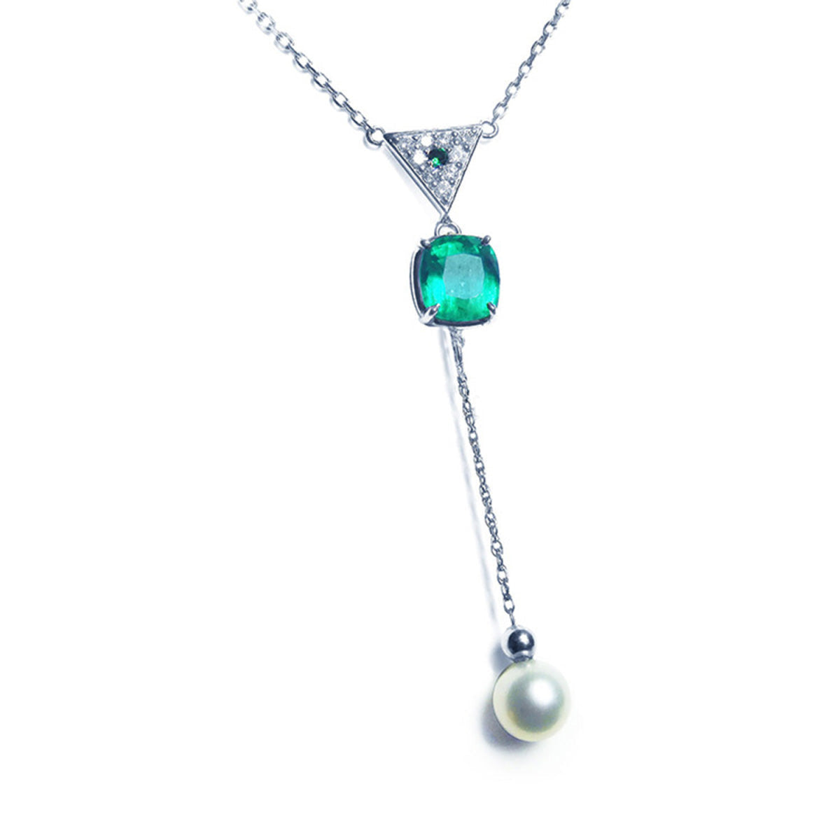 Colombian emerald necklace and freshwater pearl dangling from a triangle shaped gold with pave diamonds center piece.
