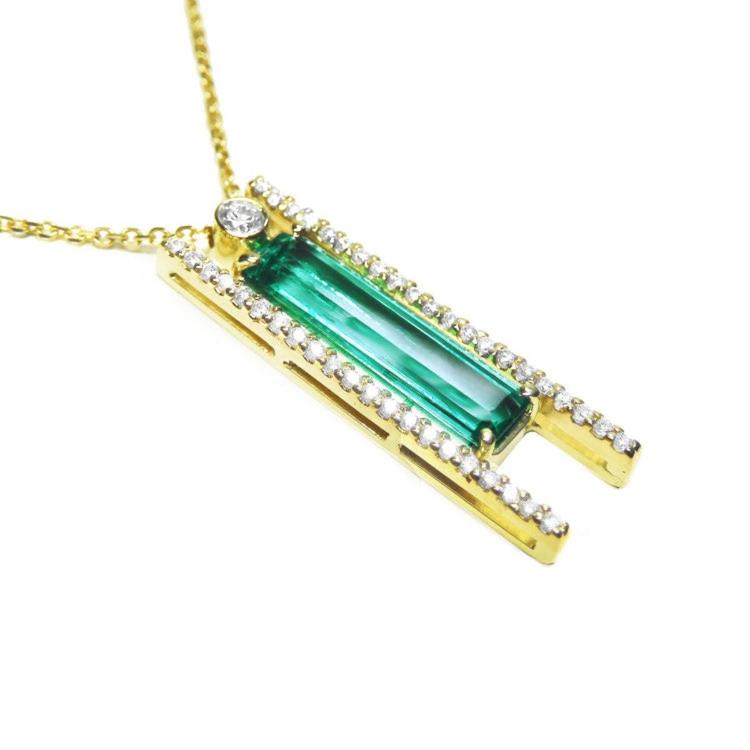 14k yellow gold necklace with a natural colombian emerald gemstone and small lateral diamonds.