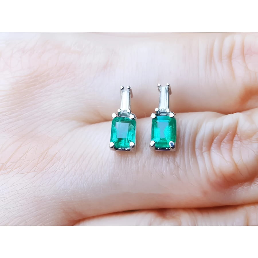 Colombian emerald and baguette diamond stud earrings, 14K white gold.