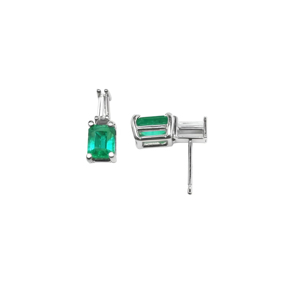 Colombian emerald and baguette diamond stud earrings in 14K white gold.