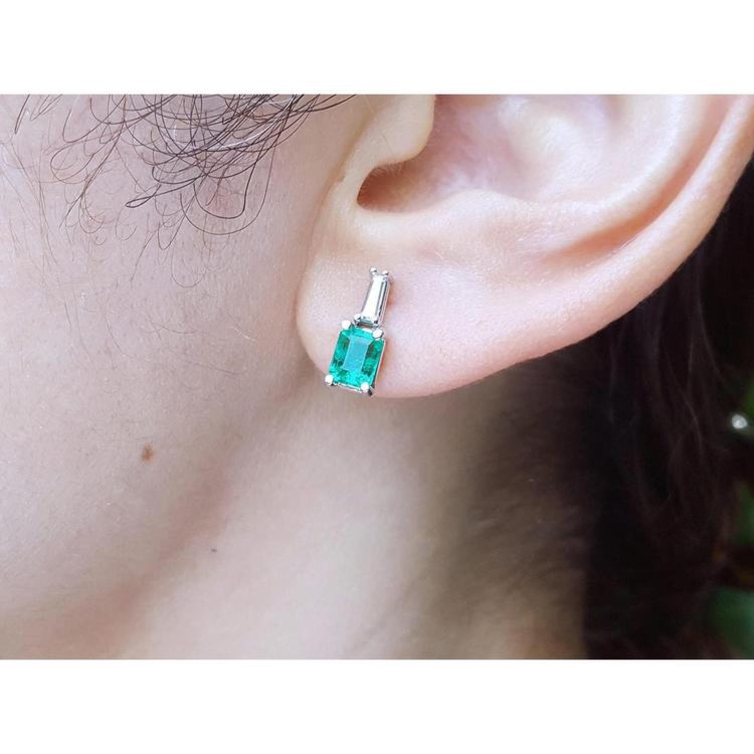 Colombian emerald and baguette diamond stud earrings, 1.10 ct., set in 14K white gold.