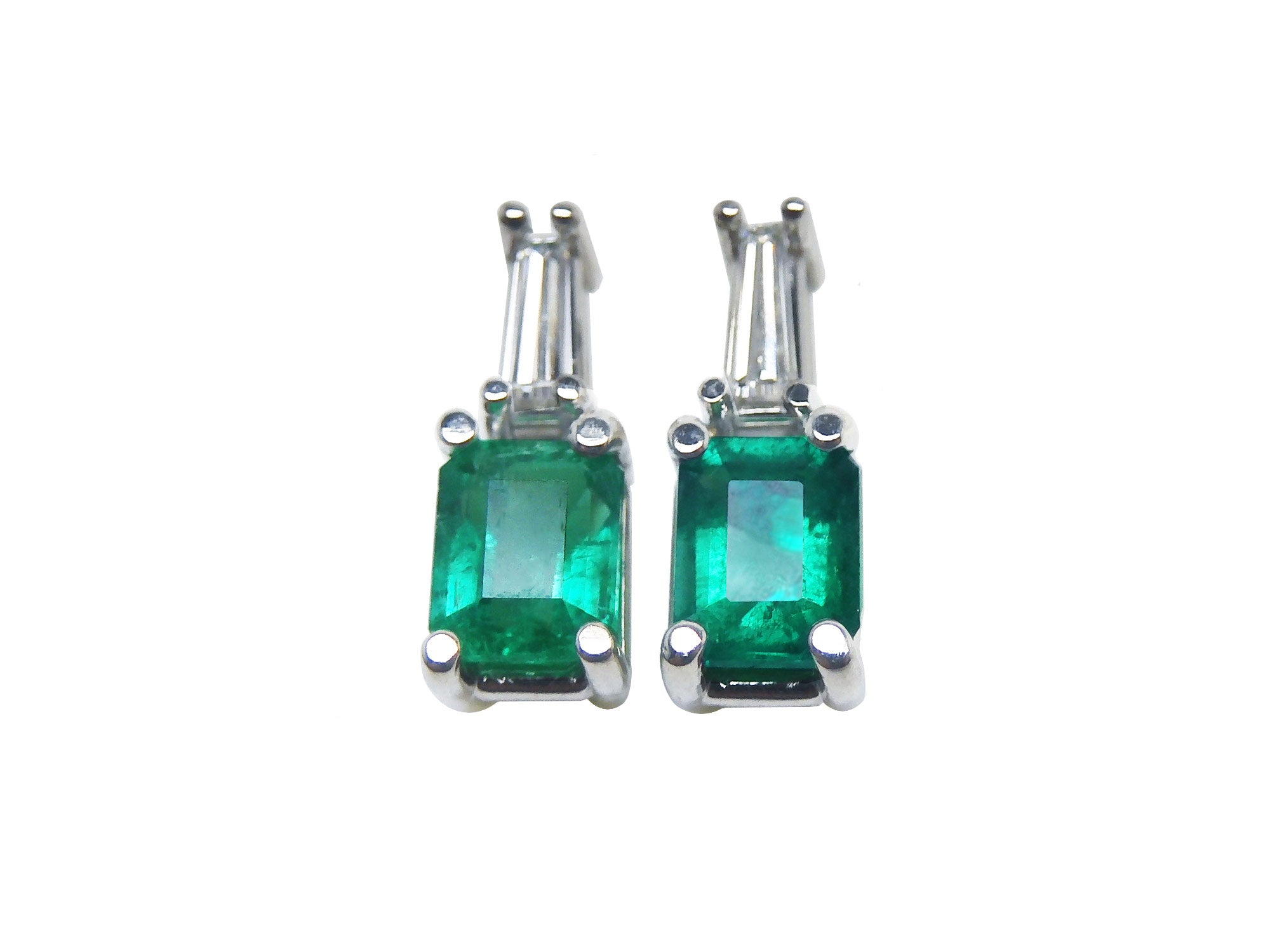 Emerald and baguette diamond earrings, 14 white gold, front side position top view.