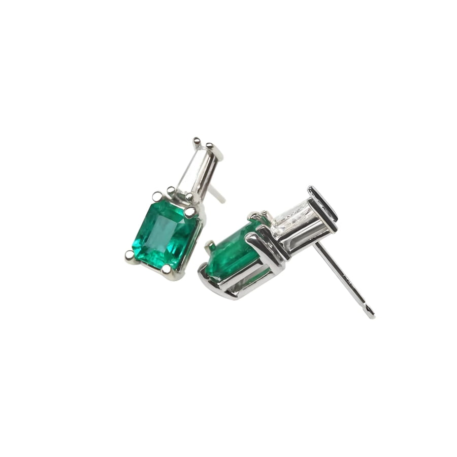 Colombian emerald and baguette diamond stud earrings, 14K white gold.