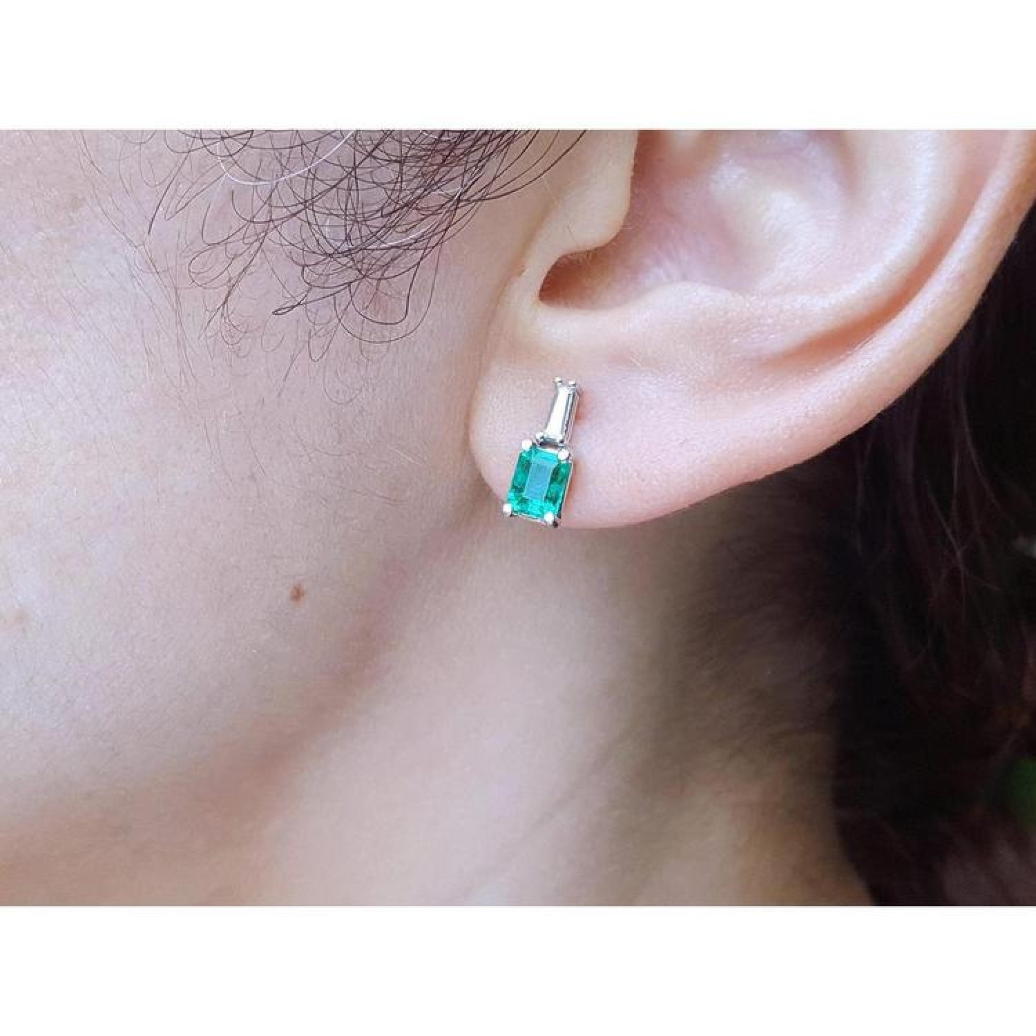 Colombian emerald and baguette diamond stud earrings, 14K white gold.
