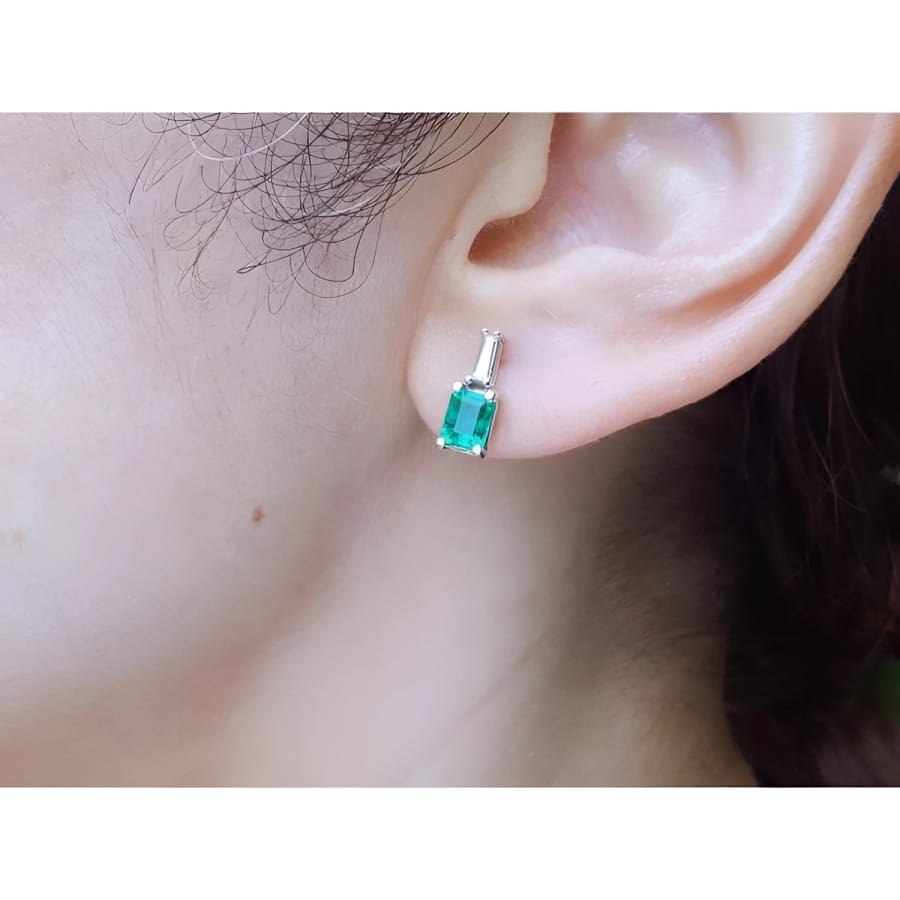 Colombian emerald and baguette diamond stud earrings, 14K white gold.