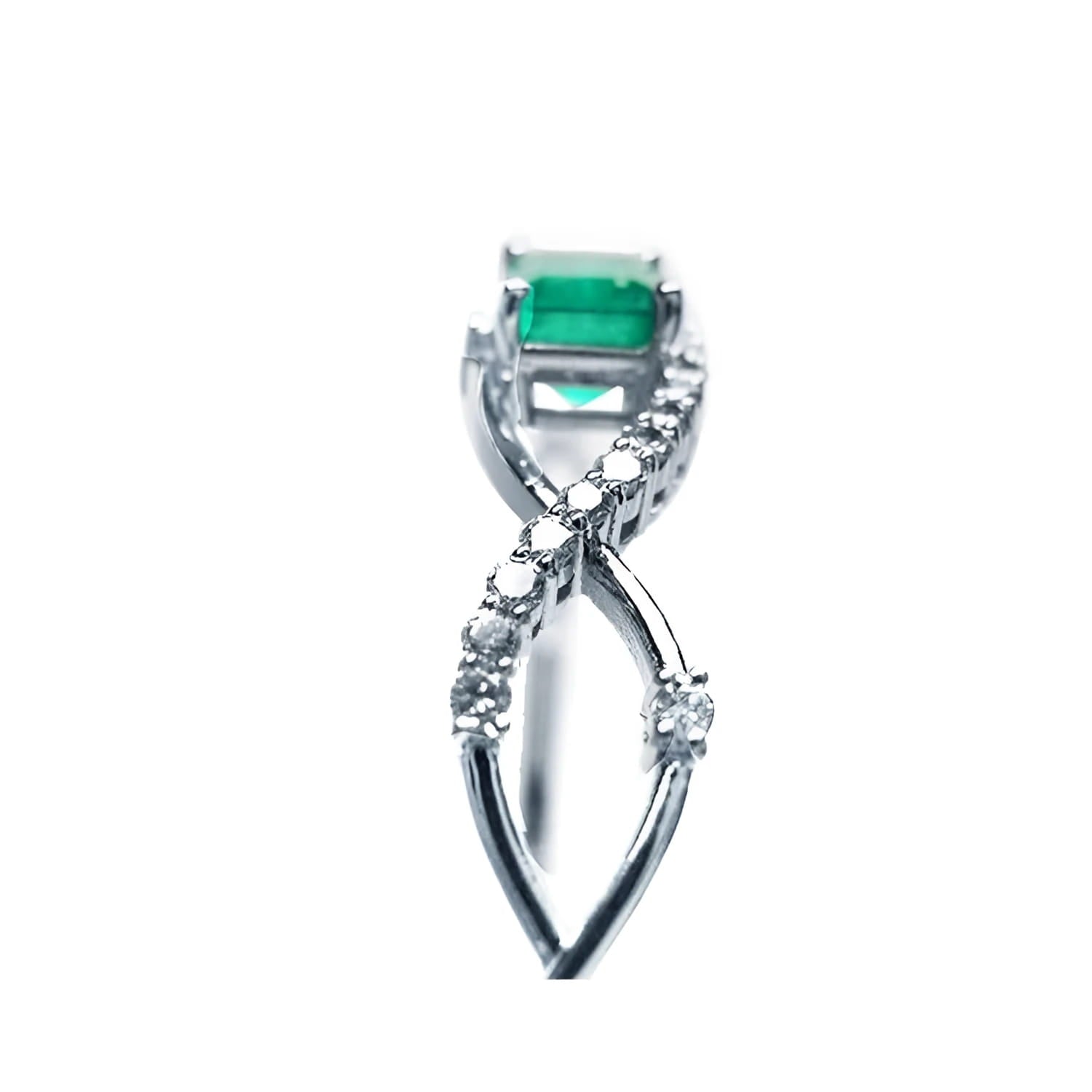 Emerald-cut emerald and natural diamond bangle bracelet in 14K white gold.