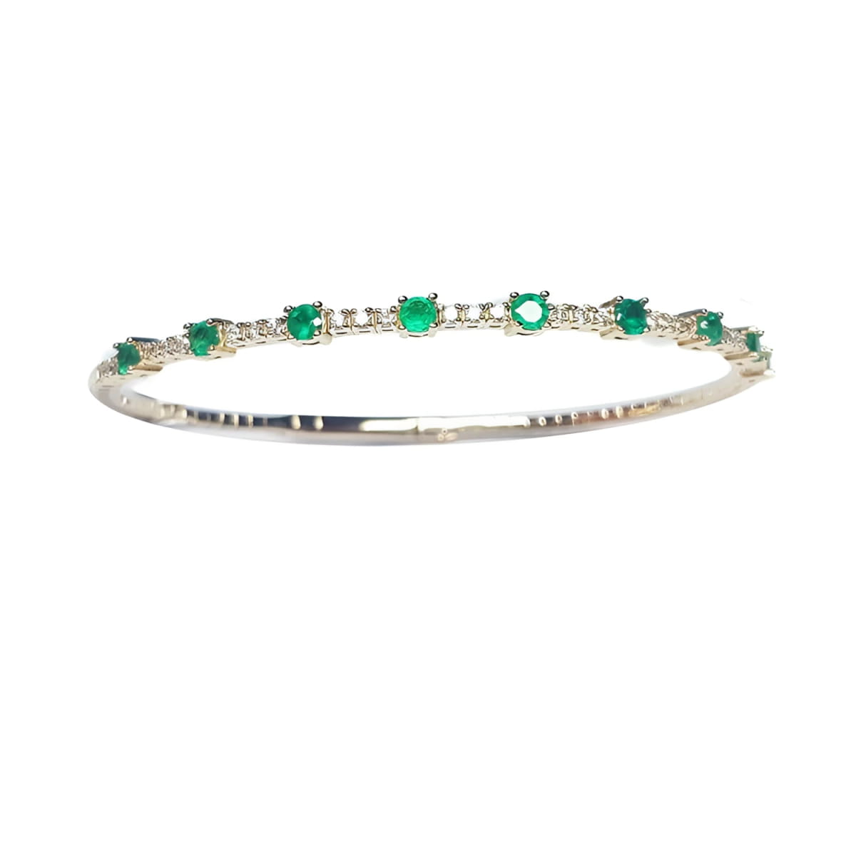women's emerald bangle bracelet flexible made in 14k yellow gold and genuine Colombian emeralds.