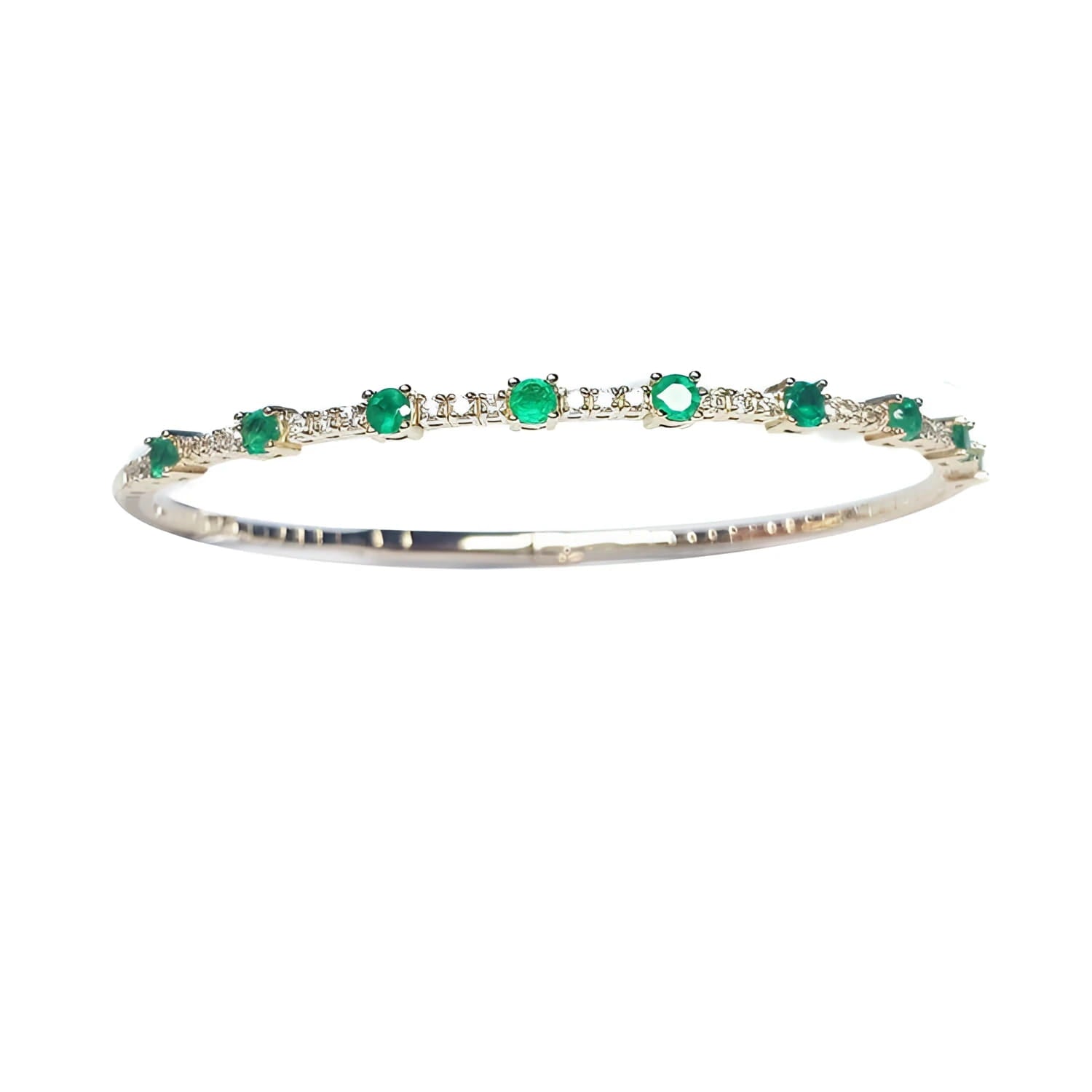 women's emerald bangle bracelet flexible made in 14k yellow gold and genuine Colombian emeralds.