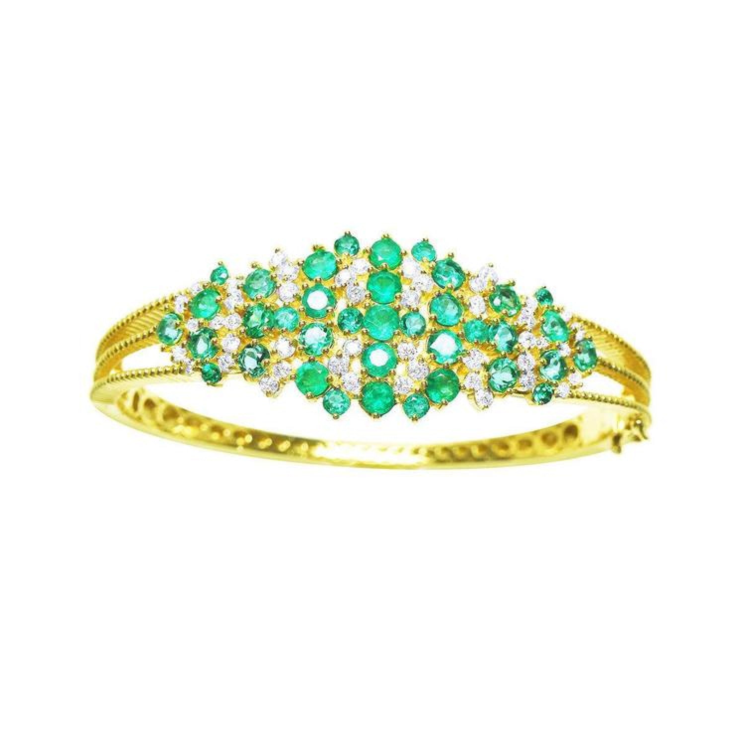 14K yellow gold bangle with round Colombian emeralds and diamonds in a floral design.