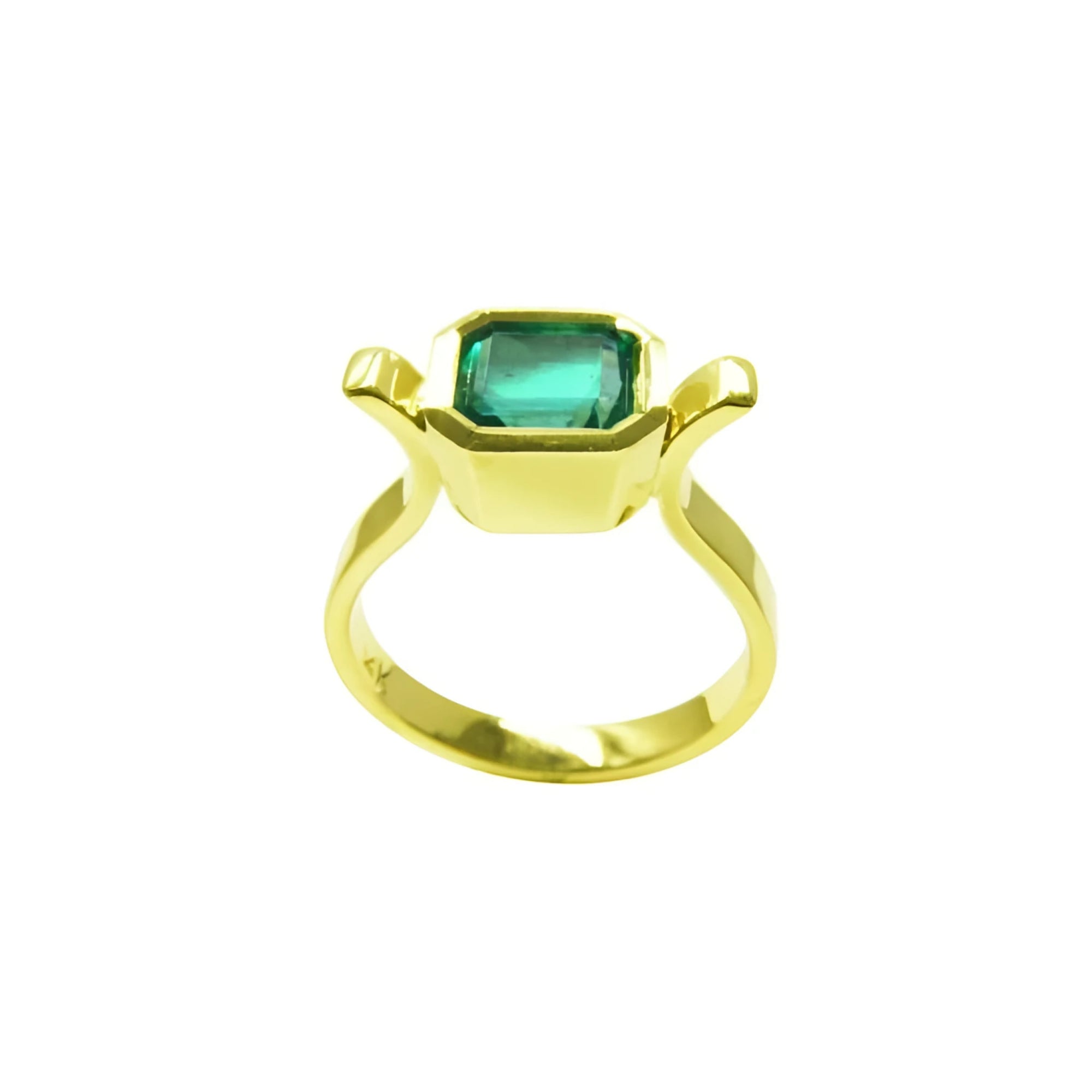 0.93 ct. solitaire Colombian emerald ring in 14K yellow gold, featuring a bezel-set emerald cut stone.