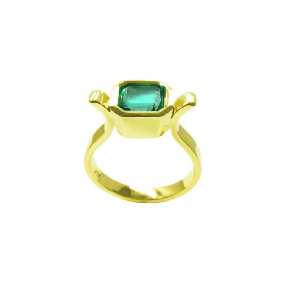 0.93 ct. solitaire Colombian emerald ring in 14K yellow gold, featuring a bezel-set emerald cut stone.