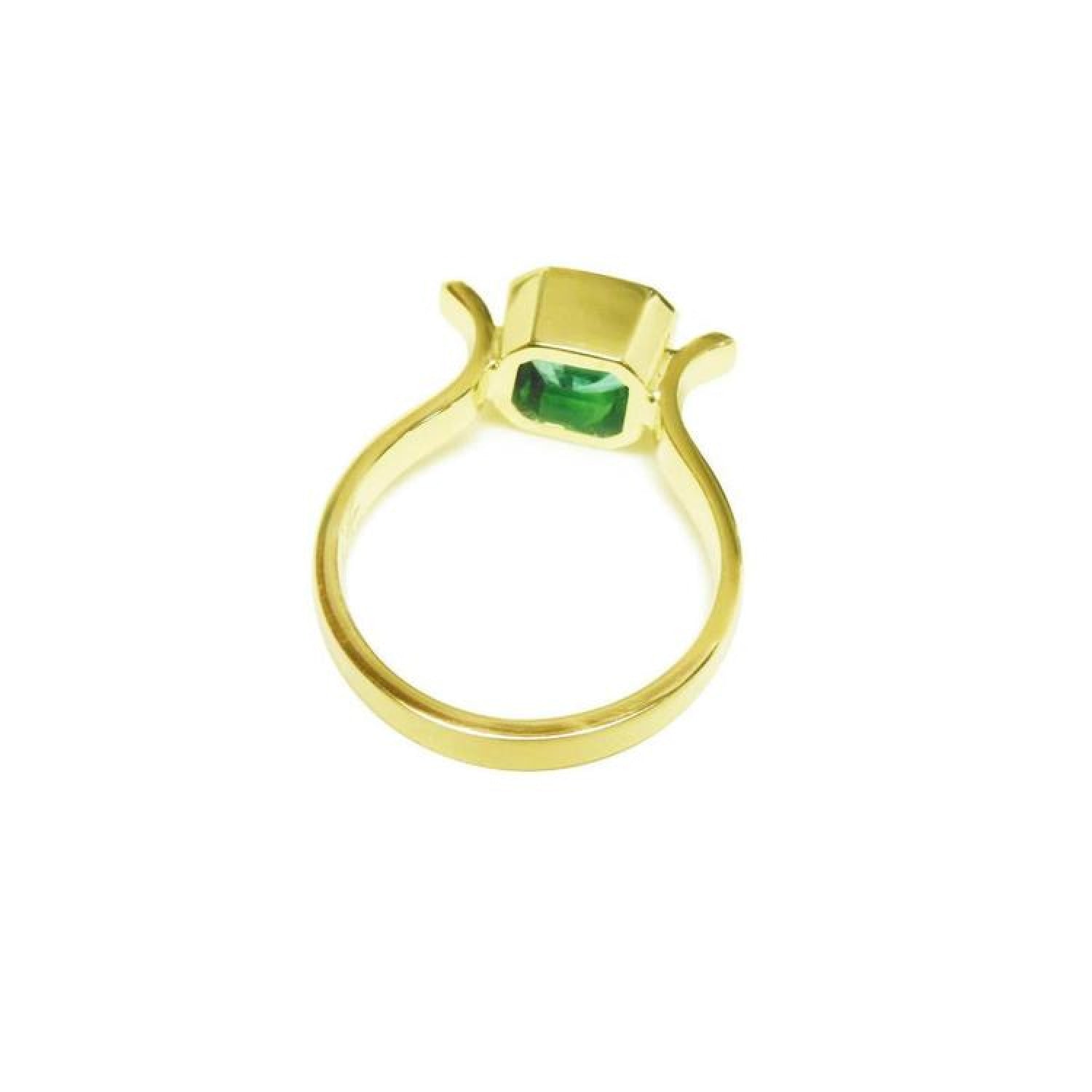 0.93 ct. solitaire Colombian emerald ring in 14K yellow gold, bezel set.