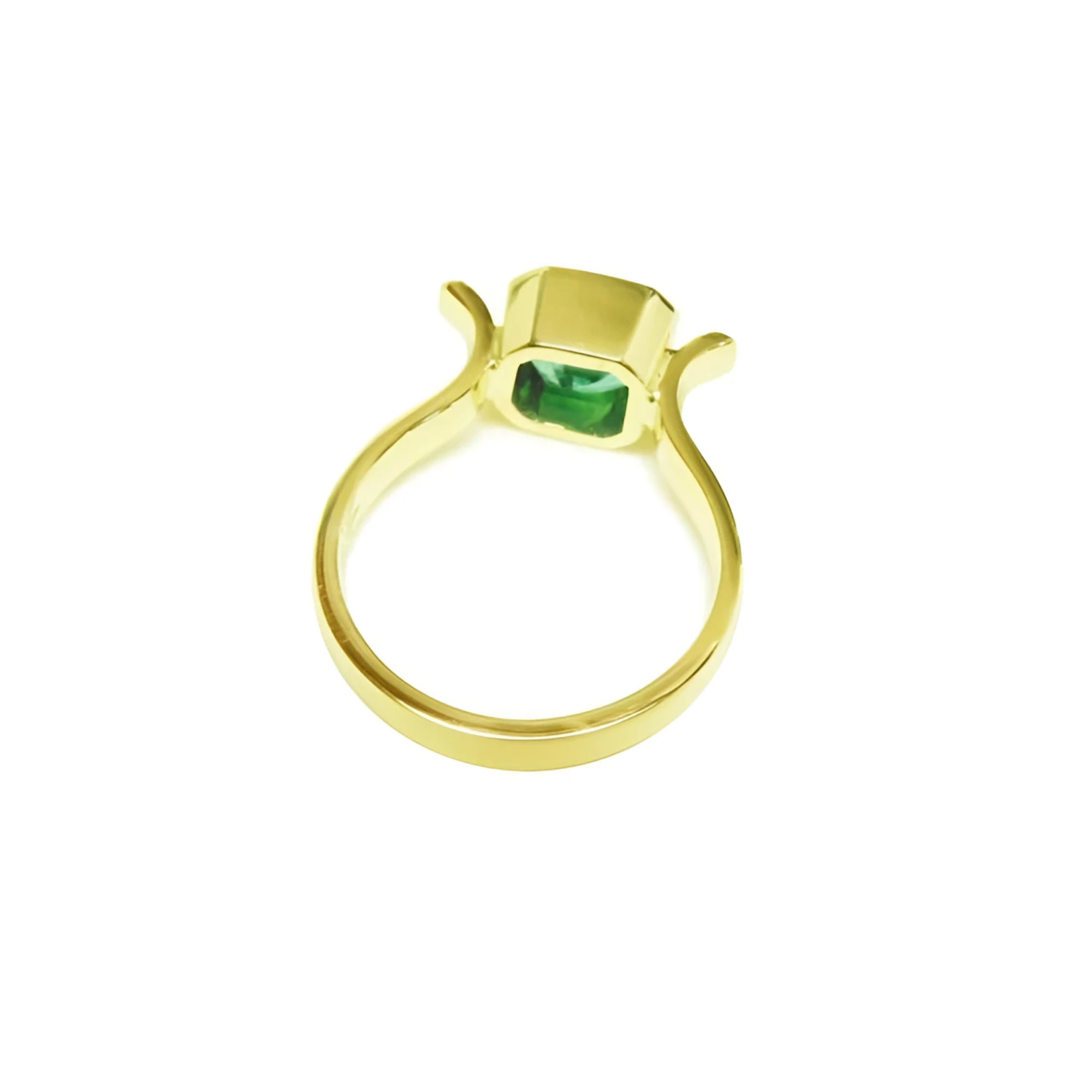 0.93 ct. solitaire Colombian emerald ring in 14K yellow gold, bezel set.