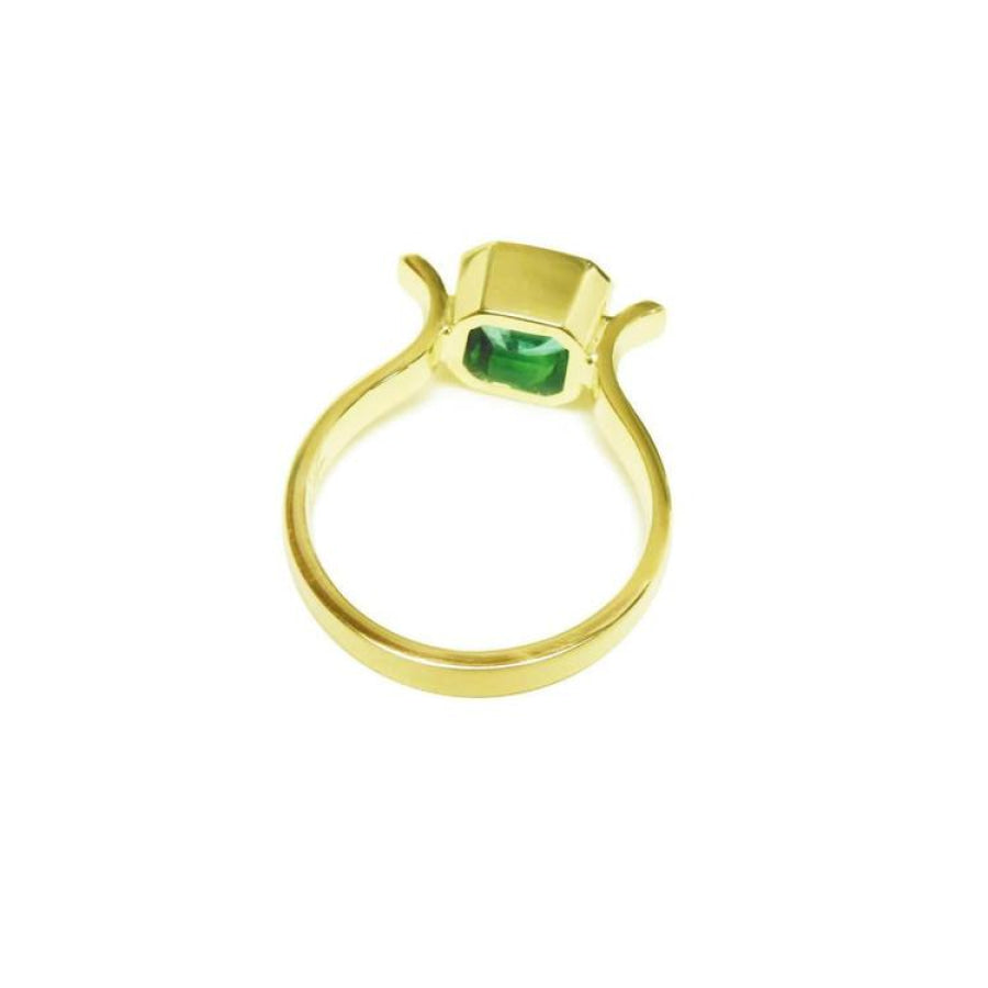 0.93 ct. solitaire Colombian emerald ring in 14K yellow gold, bezel set.