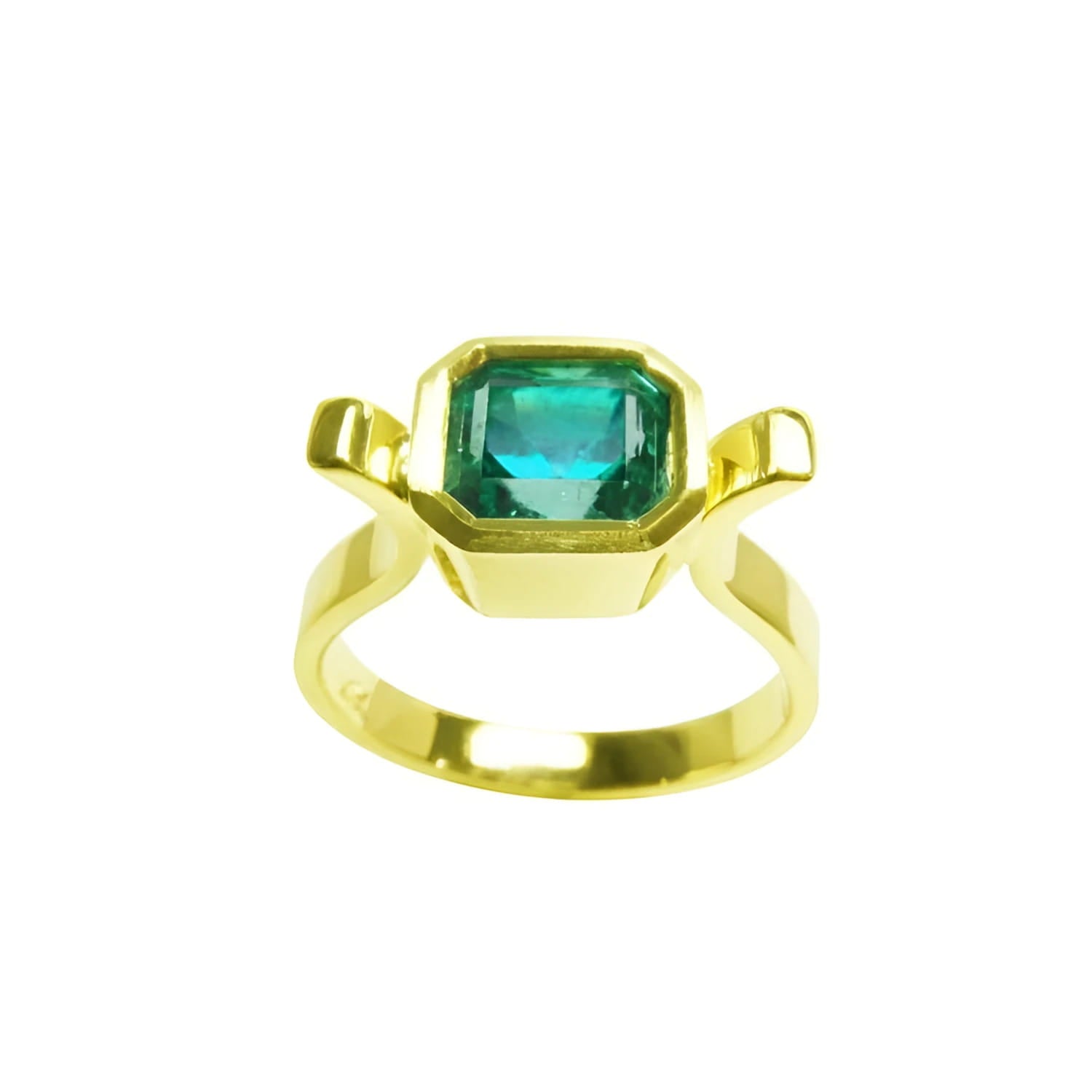 A  colombian emerald solitaire ring bezel set made of 14k yellow gold.