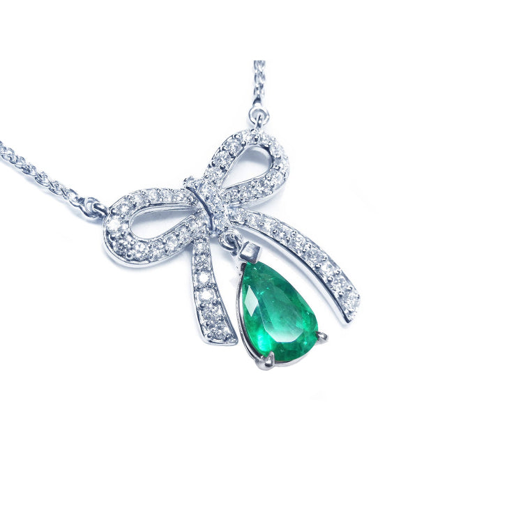 Colombian emerald bowtie necklace pear cut 1.28 carats mined in Muzo, with high quality natural diamonds pave set