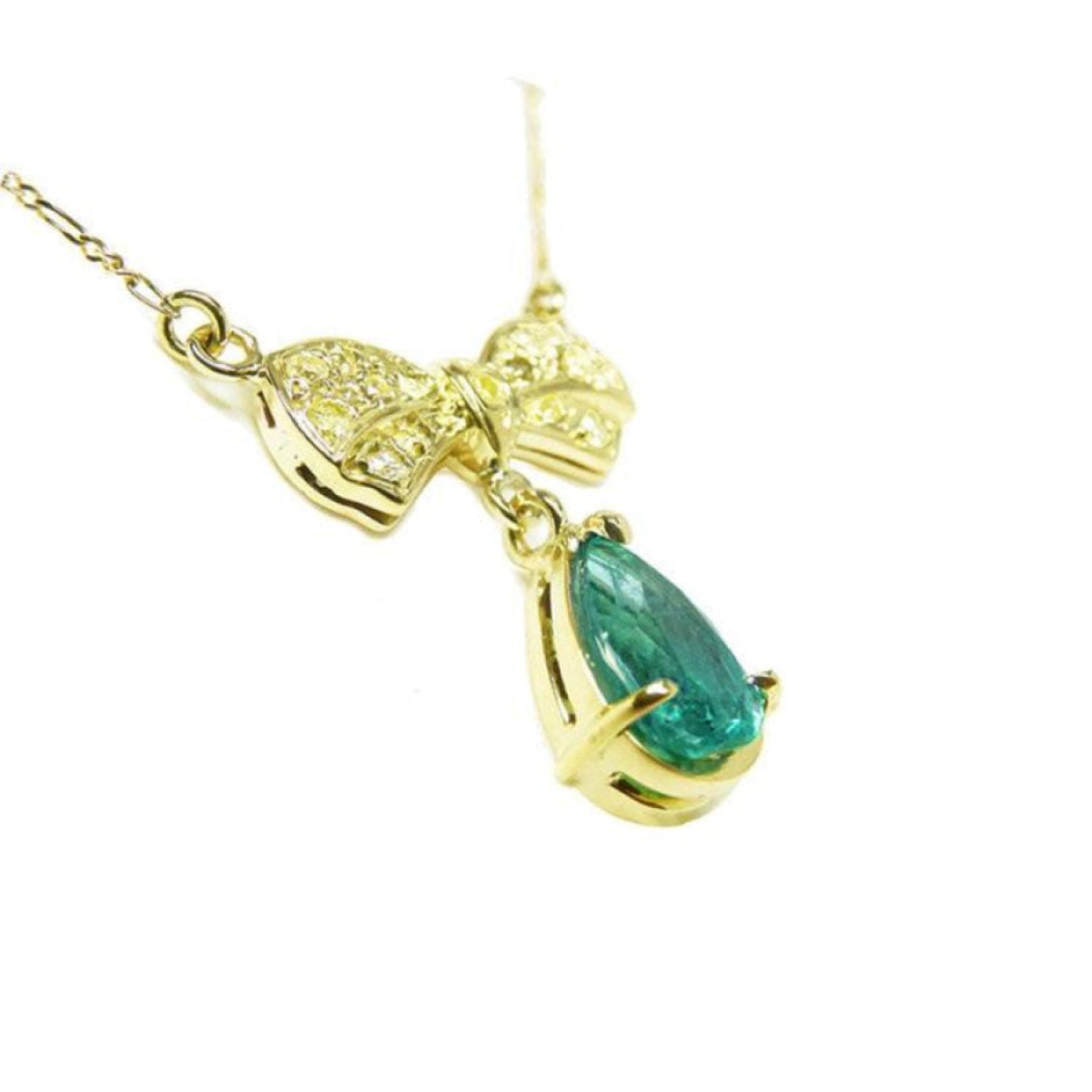 18K yellow gold bow-tie necklace with pave yellow diamonds and a dangling pear-shaped emerald.