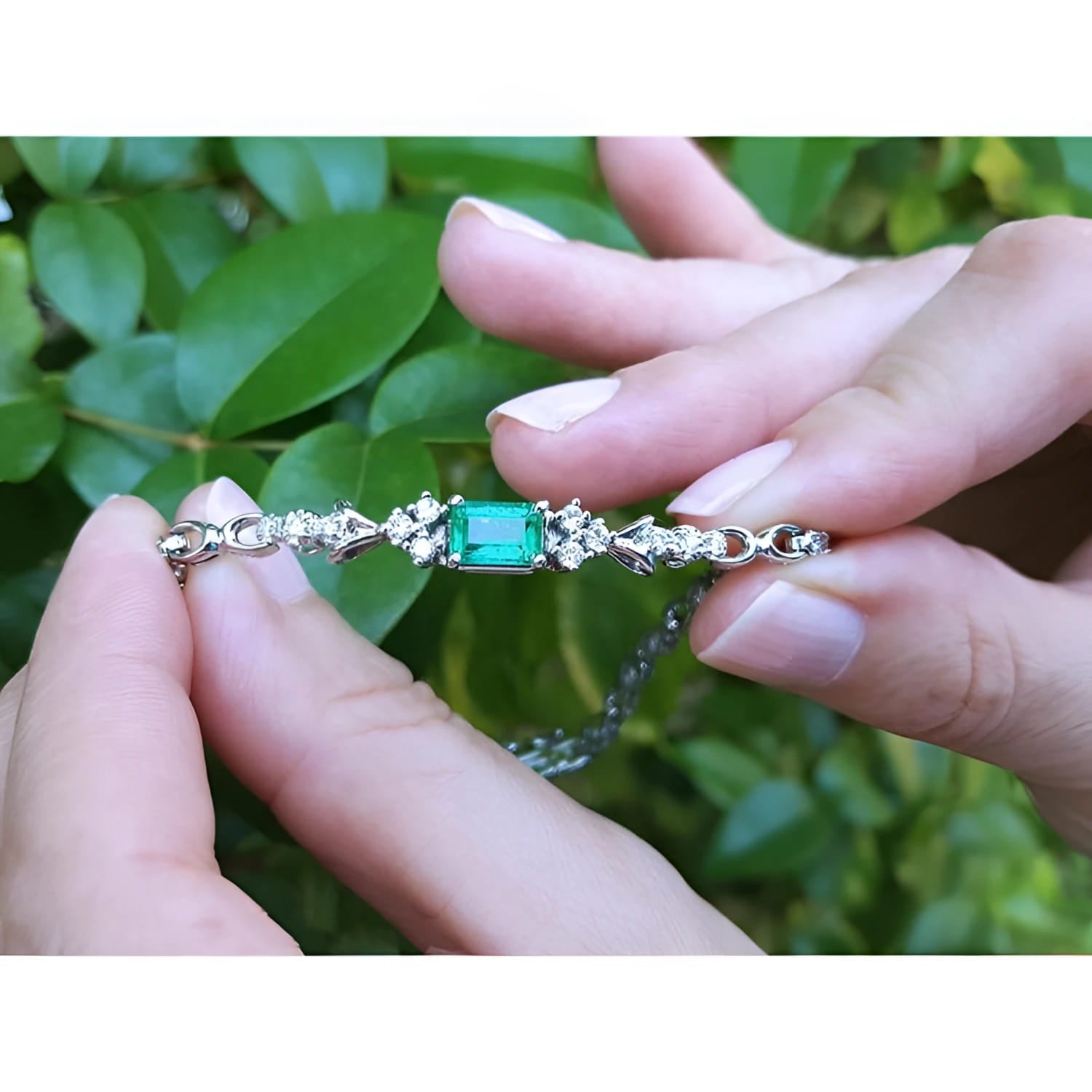 1.08 carat Muzo Colombian emerald bracelet in 14K white gold with rectangular emerald-cut and diamond accents.