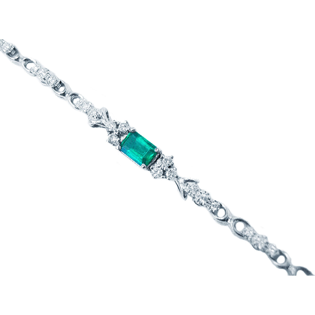 A far view of a white gold emerald bracelet.