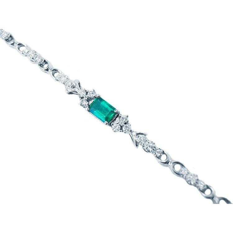 1.08 carat Muzo Colombian emerald bracelet with rectangular deep bluish-green emerald and diamond accents in 14K white gold.