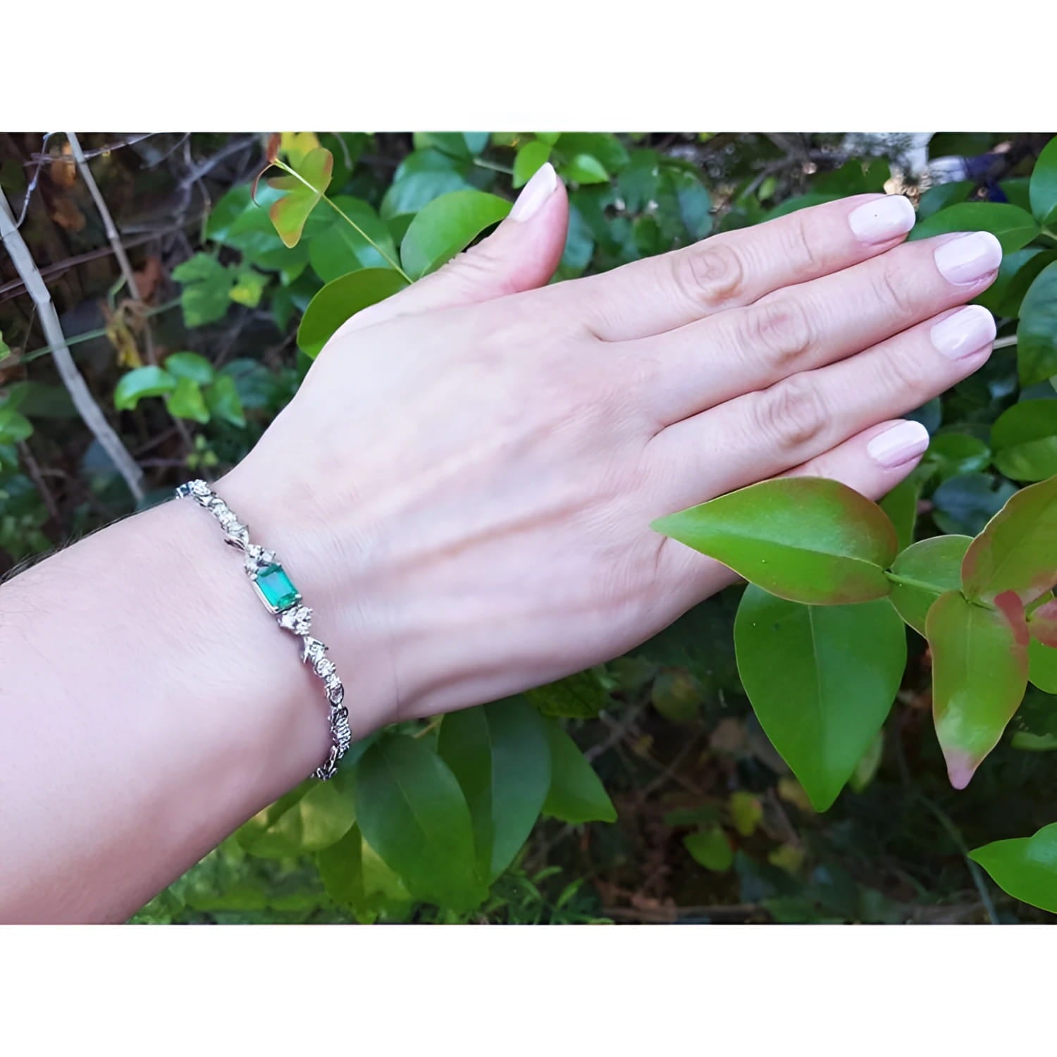 1.08 carat Muzo Colombian emerald bracelet with rectangular deep bluish-green emerald and diamond accents in 14K white gold.
